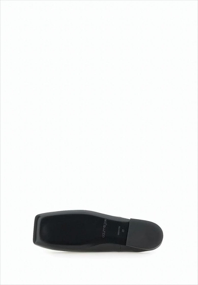 Minimalist Black Lambskin Slip-On Mules with Embossed Detail