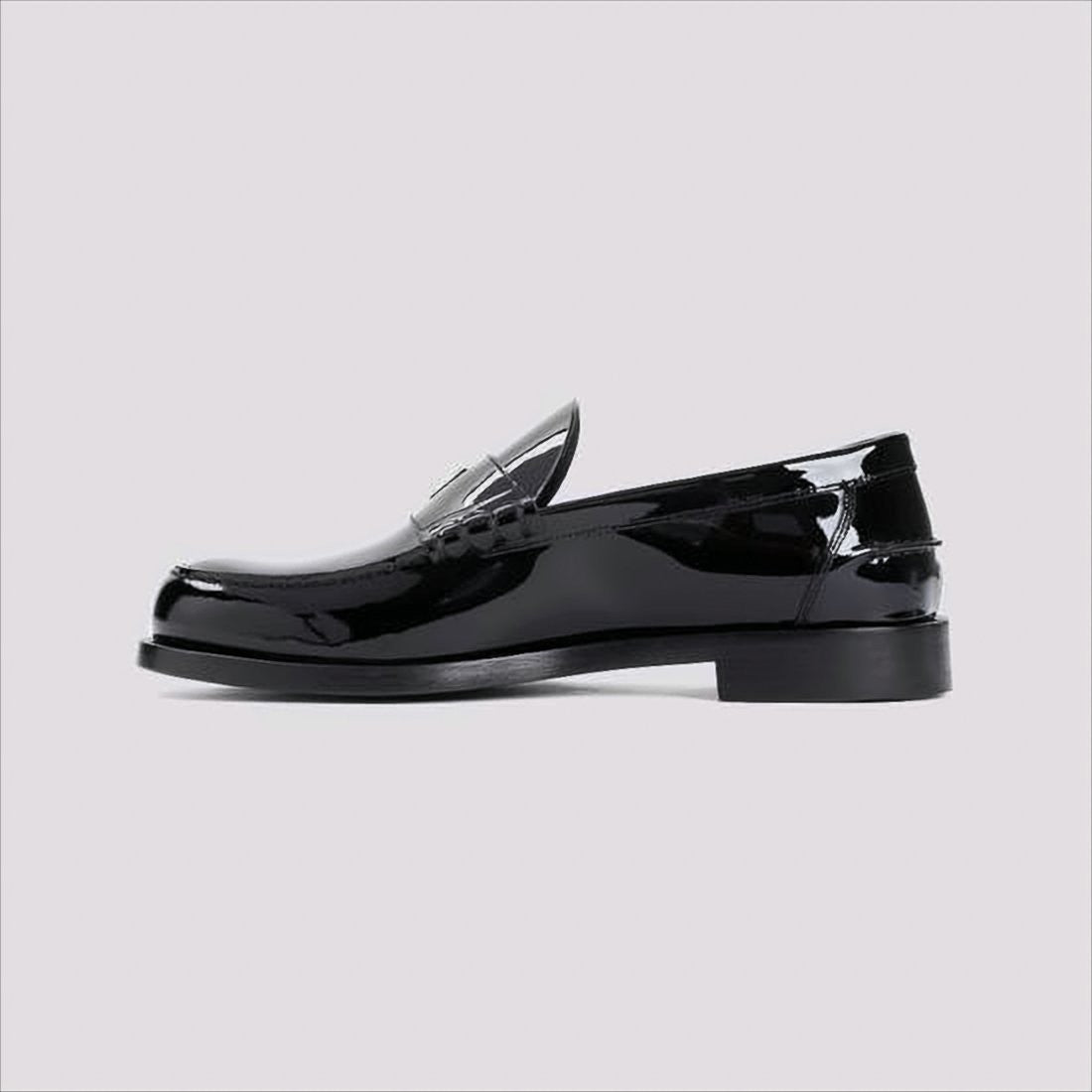 Glossy Black Moc Toe Loafers with Metallic Details