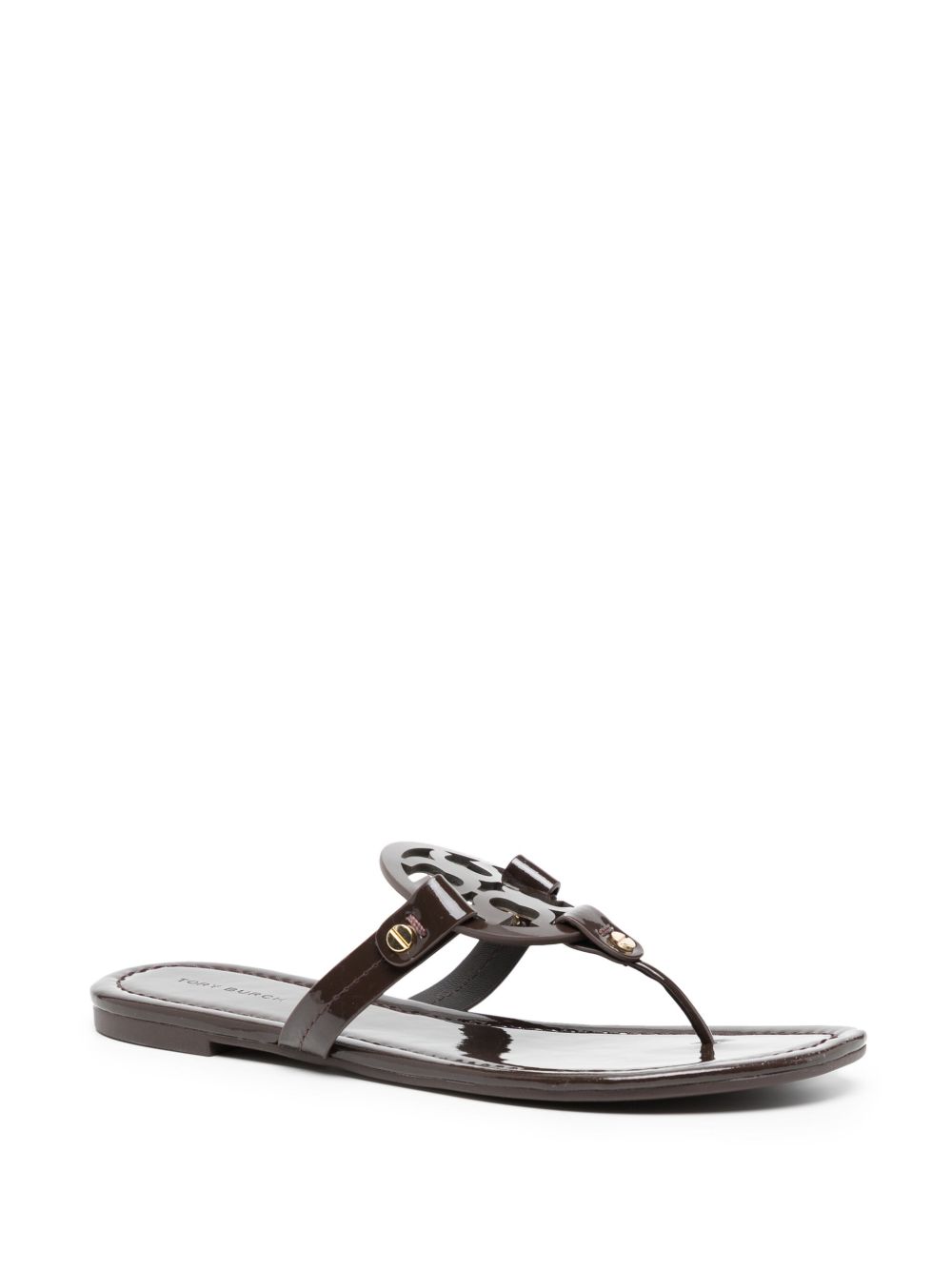 Glossy Black Flats With Circular Emblem Detail