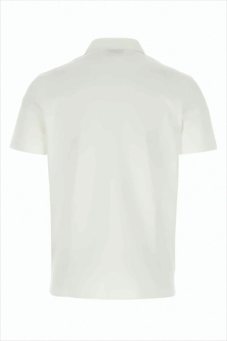 White Polo Shirt with Traditional Collar and Embroidered Emblem