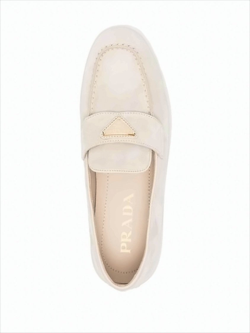 Minimalist Suede and Calf Leather Loafers with Metallic Emblem
