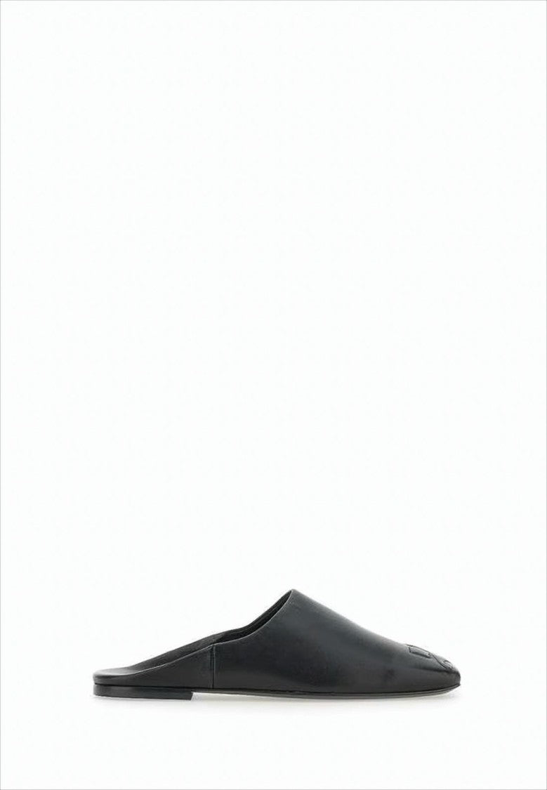 Minimalist Black Lambskin Slip-On Mules with Embossed Detail