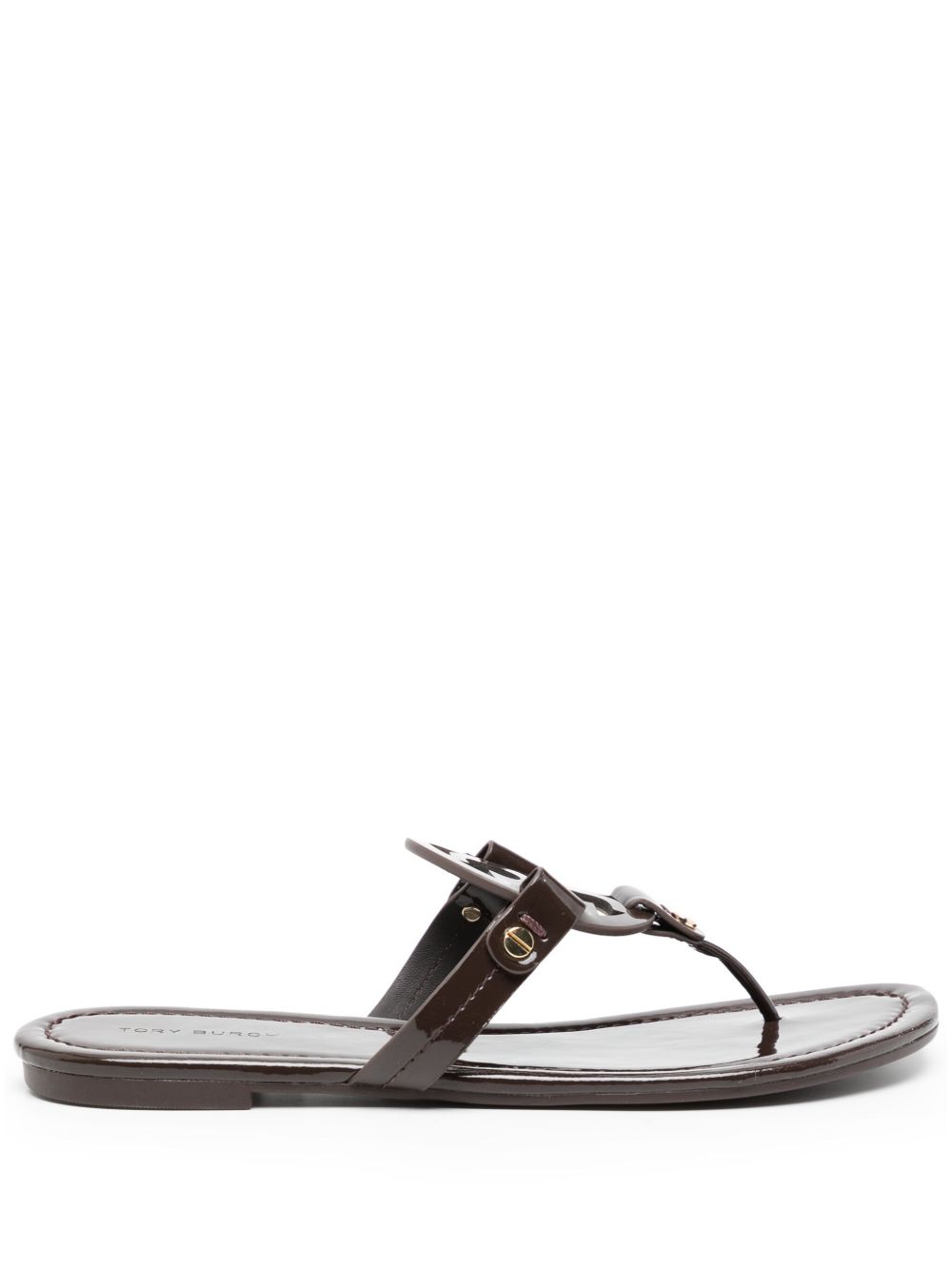 Glossy Black Flats With Circular Emblem Detail