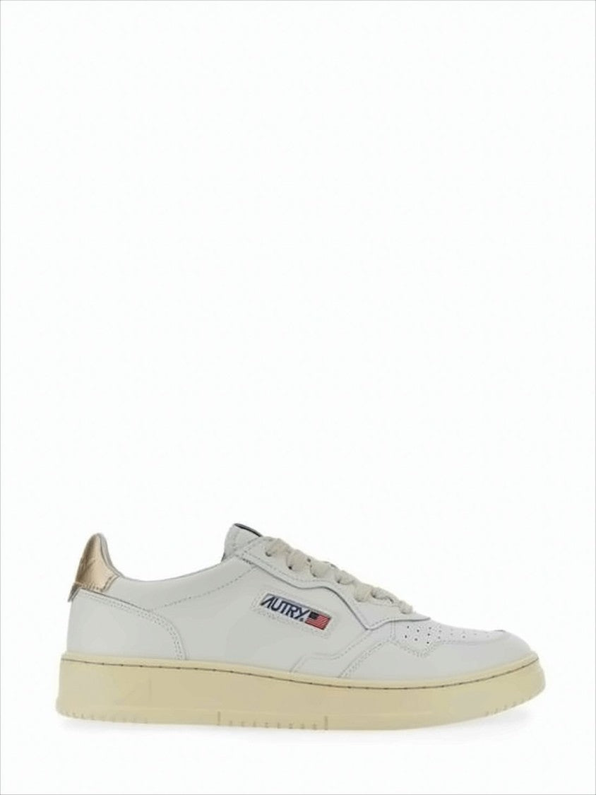Low-Top White Sneakers with Perforated Detailing and Metallic Accents