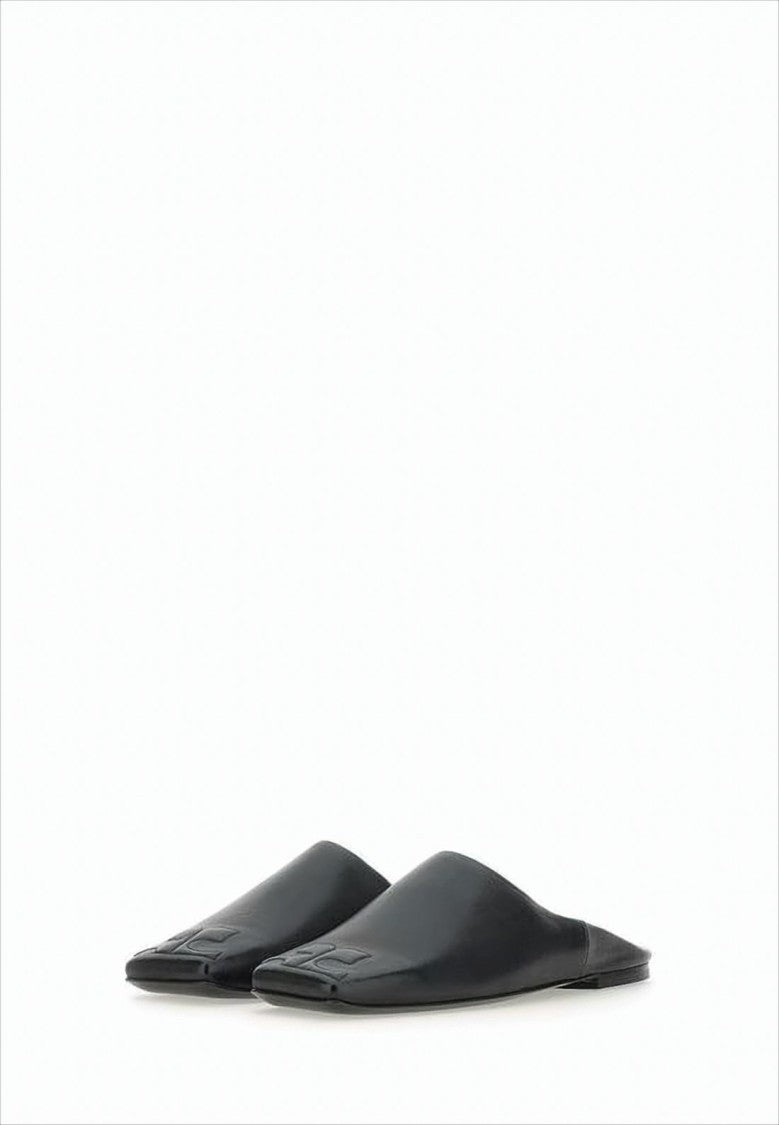 Minimalist Black Lambskin Slip-On Mules with Embossed Detail