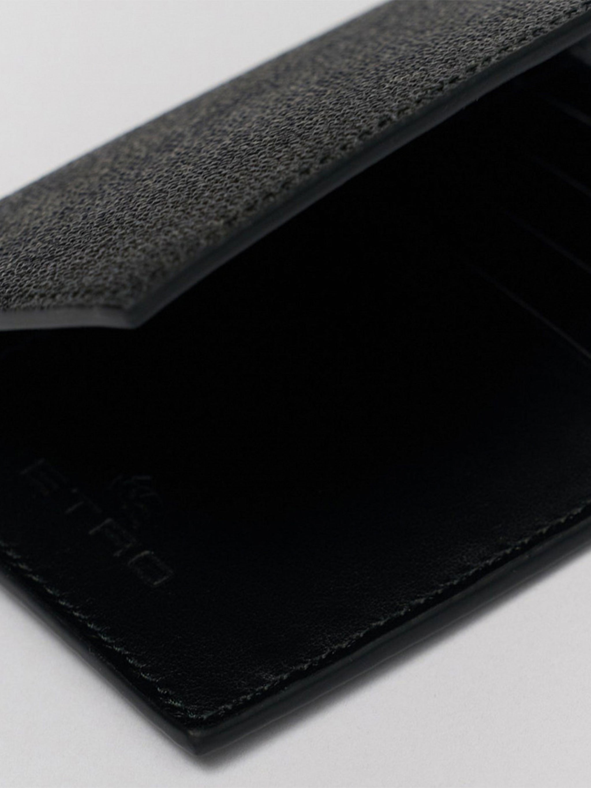 Textured Black Leather Emblem Passport Holder