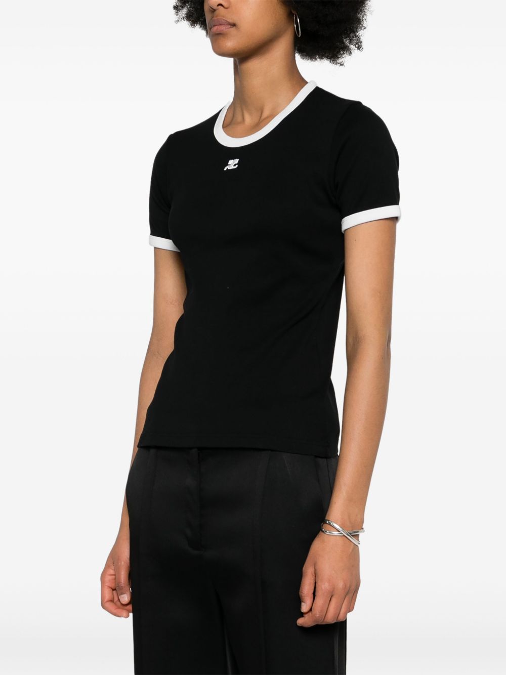 Fitted Black Top With Contrast Trim And Subtle Logo