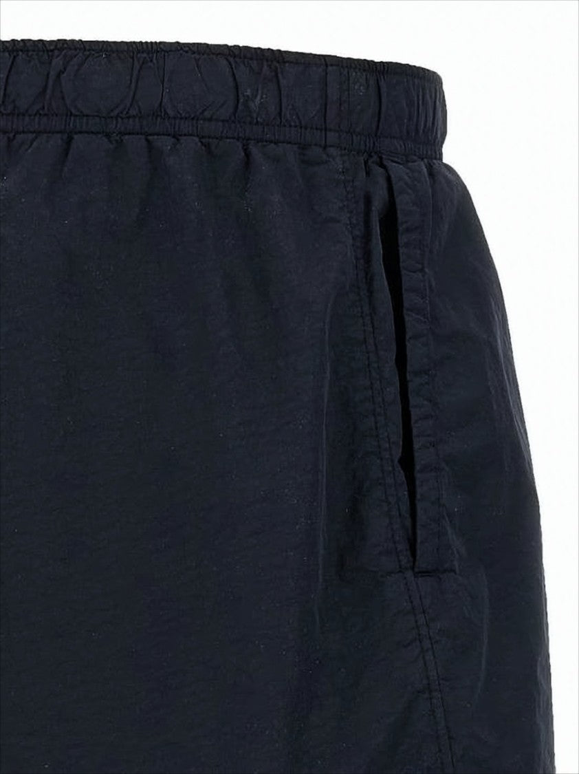 Minimalist Blue Swim Shorts with Distinctive Lens Detail