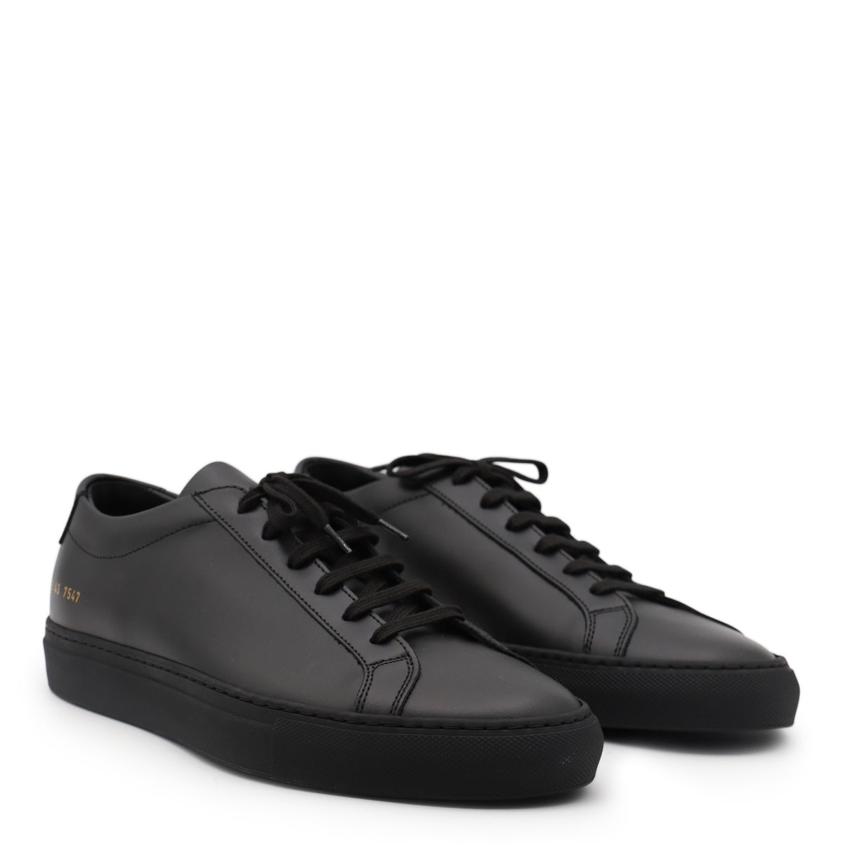 Minimalist Black Leather Sneakers With Gold Detailing
