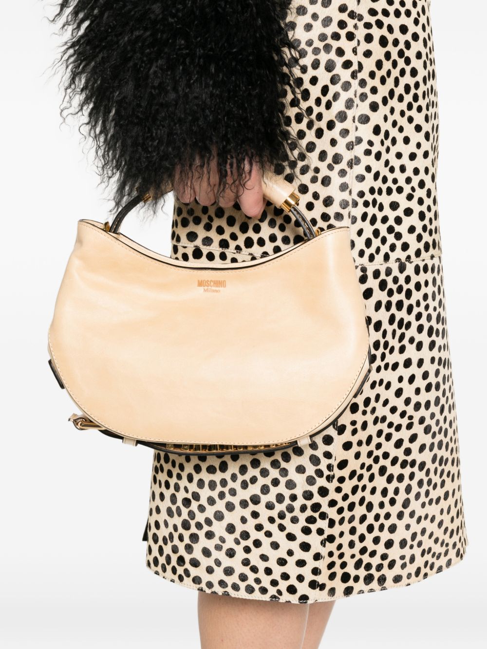 Crescent-Shaped Bag With Structured Handle