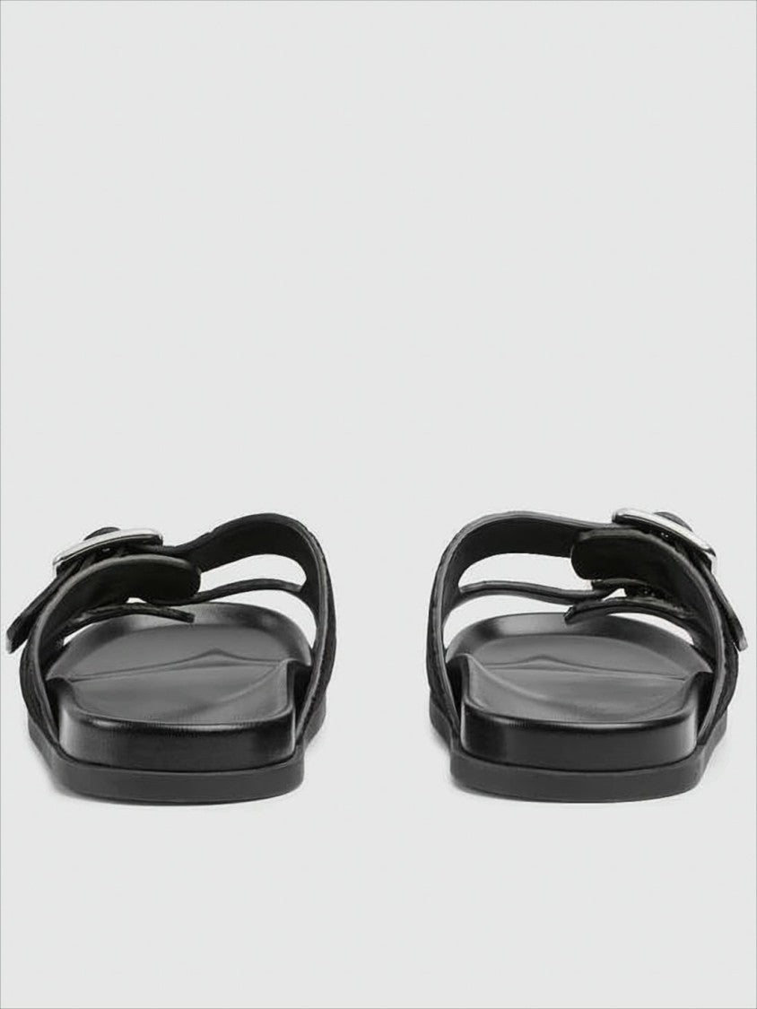 Monogram-Patterned Black Suede Sandals