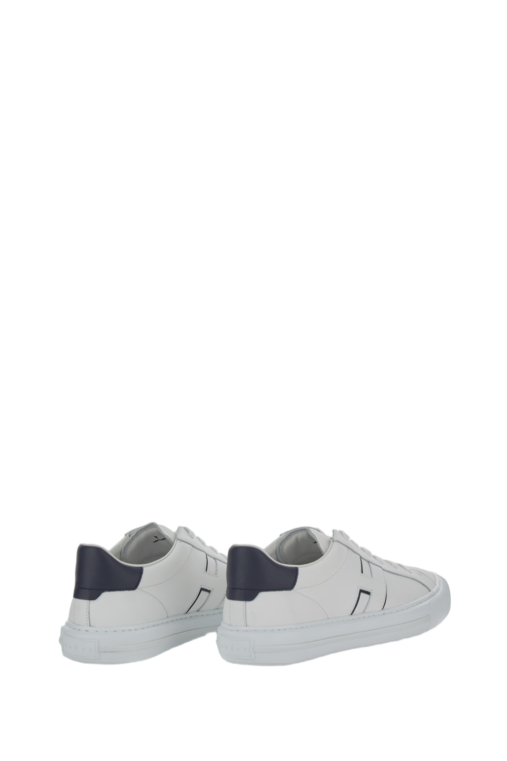 Low-Top Leather Sneakers With Minimalist Design And Distinctive Detailing