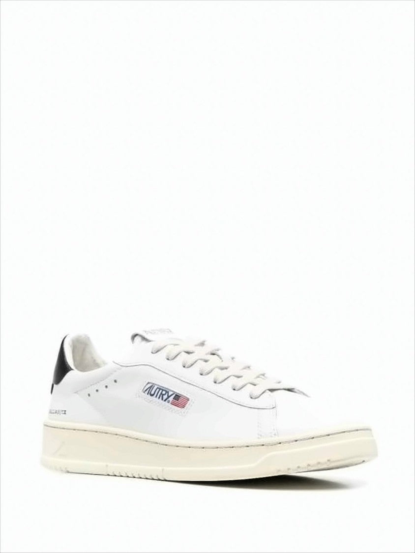 Minimalist White Leather Low-Top Sneakers With Subtle Perforations