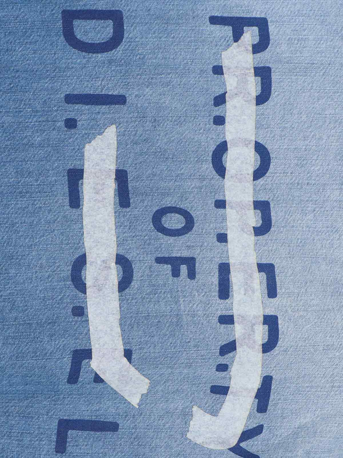 Denim Shirt With V-Neckline And Bold Back Graphic