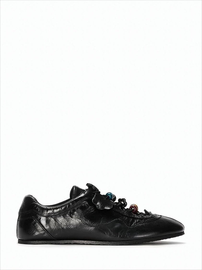 Pointed Toe Black Cowhide Flats with Floral Appliqués