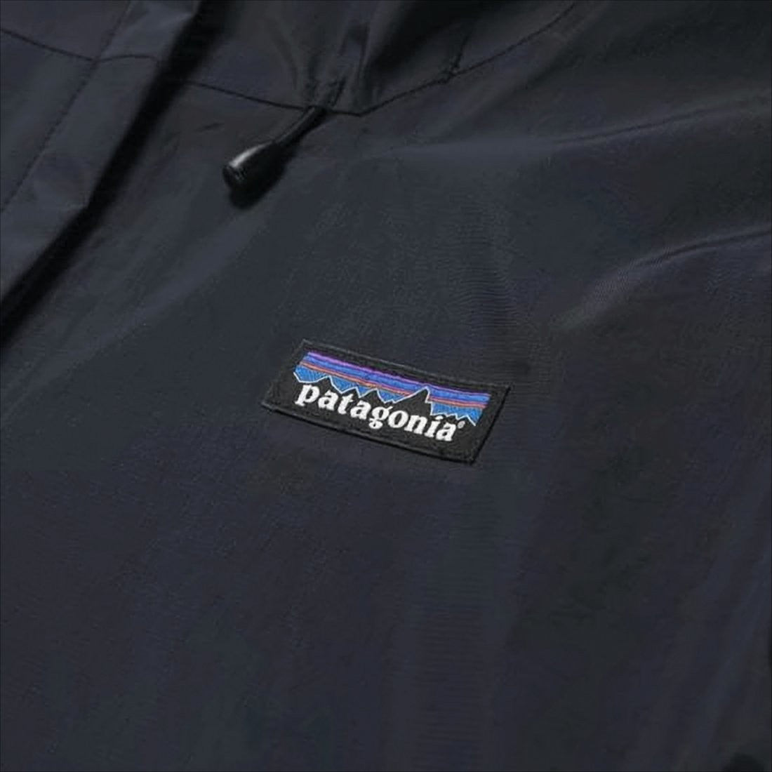 Sleek Minimalist Black Jacket With Hood And Practical Features