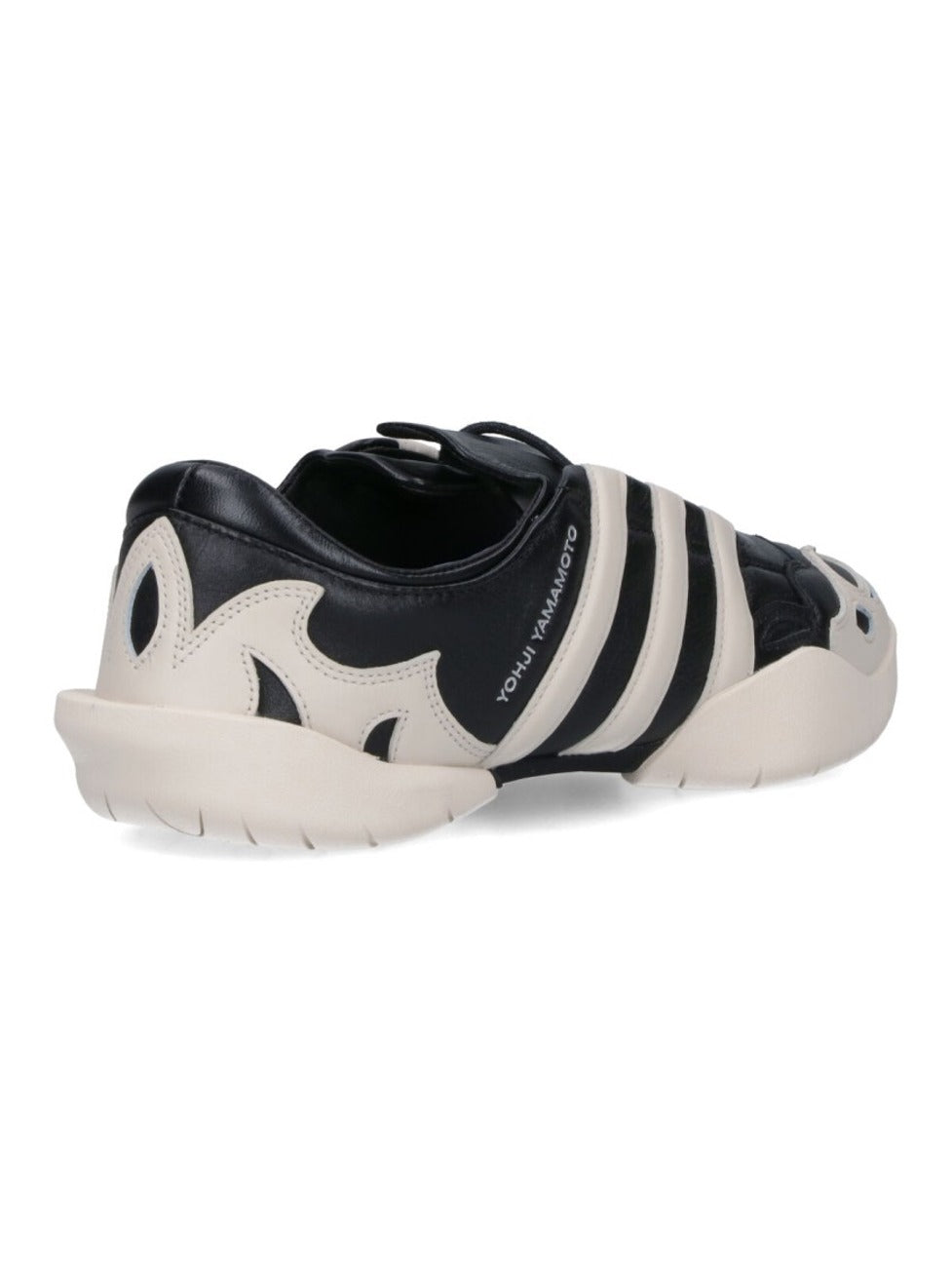 Black Leather Sneakers With Cream Accents And Iconic Stripes