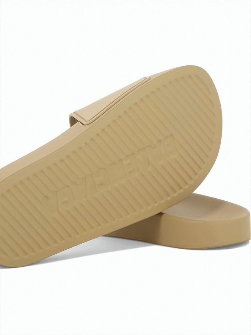 Rubber Slip-On Mules With Textured Sole And Raised Lettering