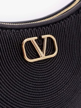 Crescent-Shaped Textured Lambskin Shoulder Bag with Metallic Emblem