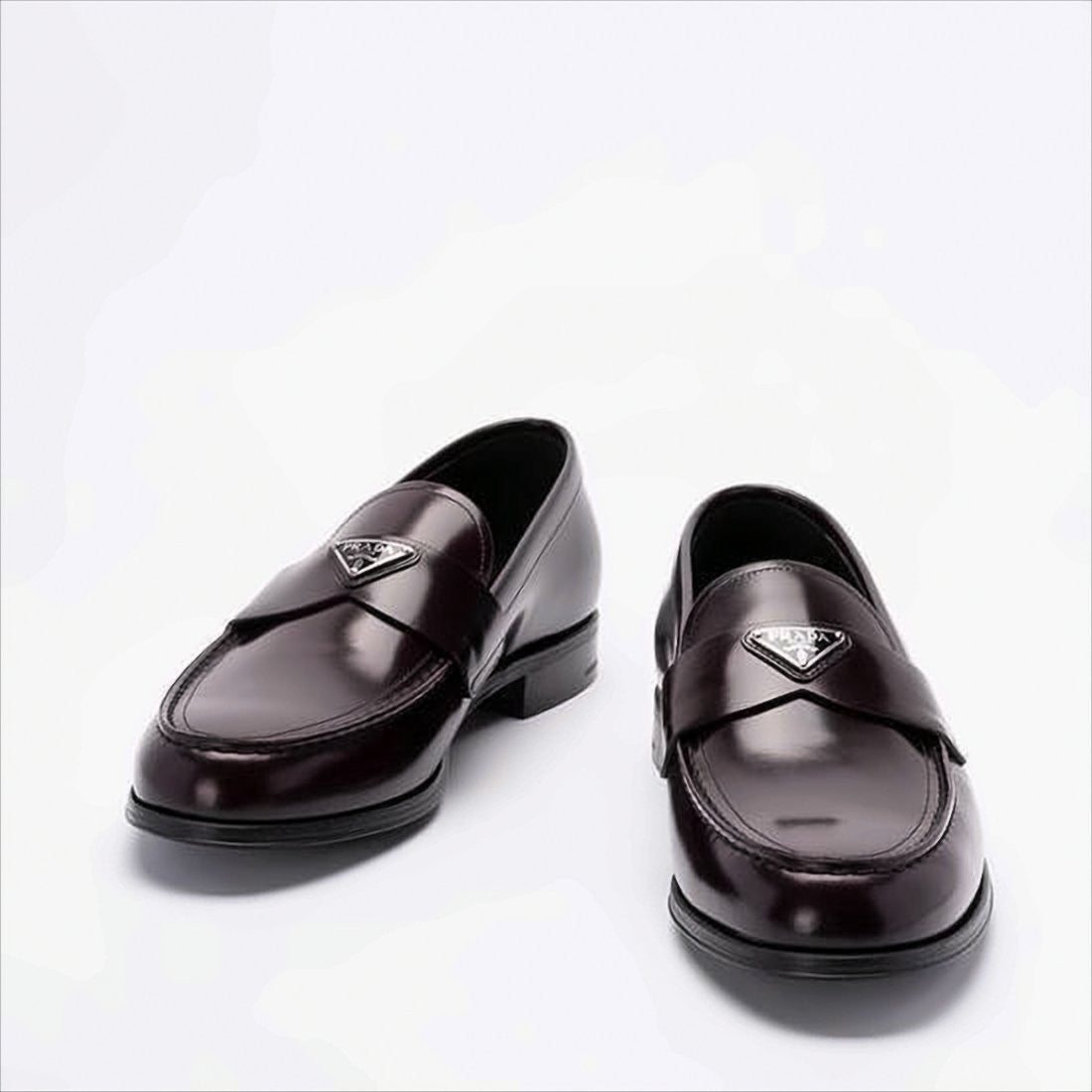 Burgundy Leather Loafers with Metallic Emblem