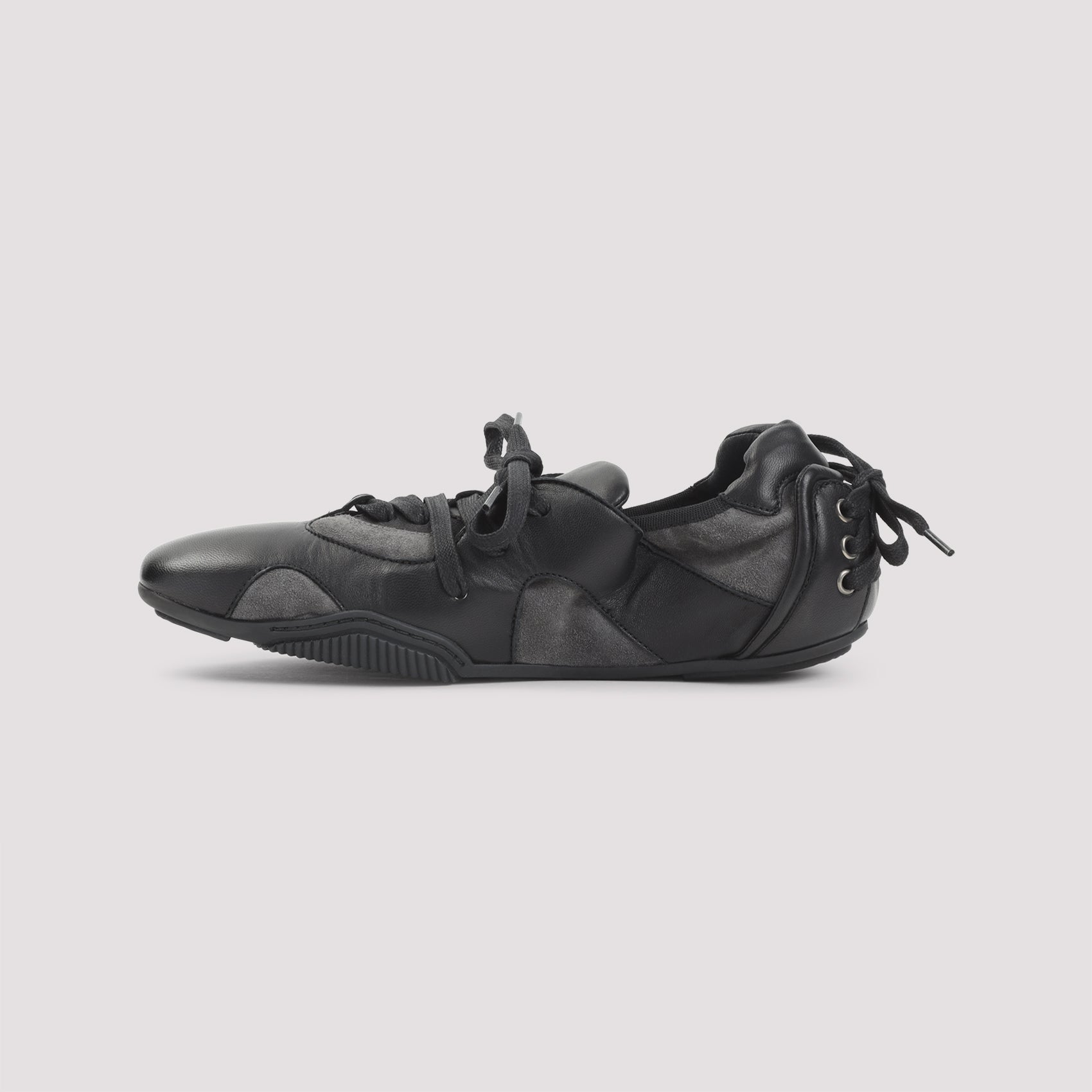 Low-Profile Black Sneakers with Distinctive Logo
