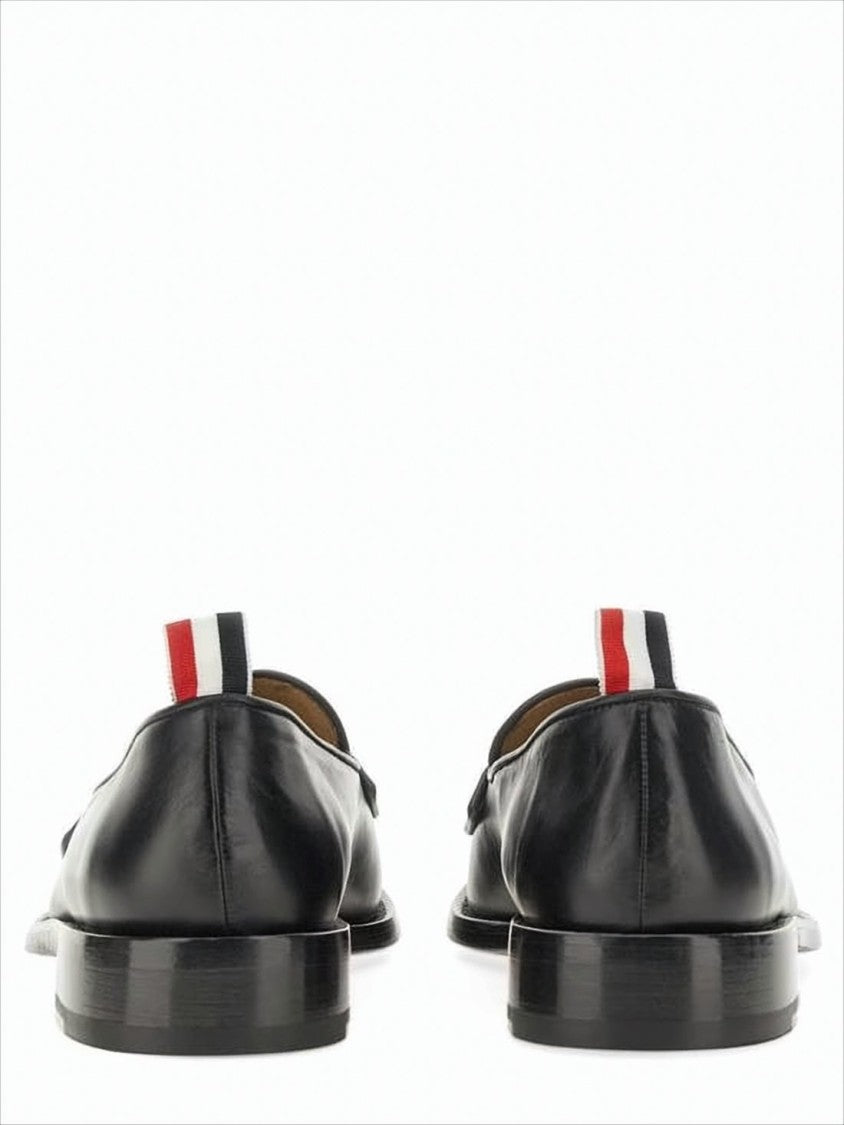Classic Black Penny Loafers with Signature Striped Pull Tab