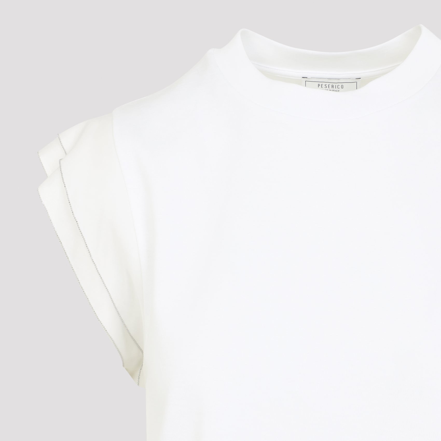 Sleeveless White Top With Layered Ruffle Details