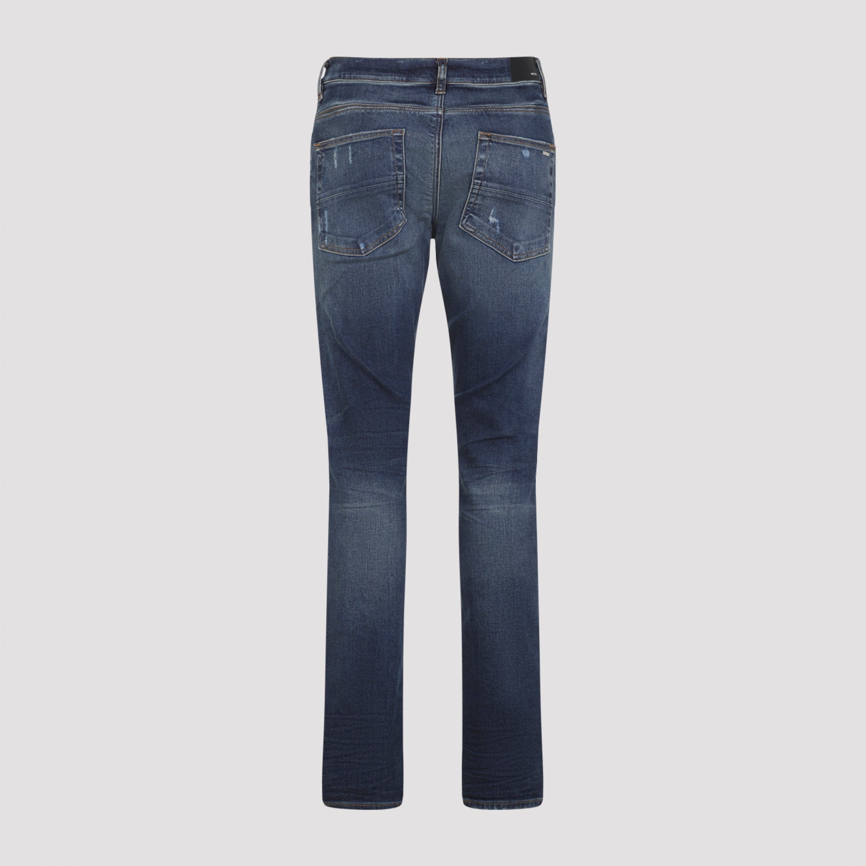 Distressed Blue Jeans With Edgy Ripped Details