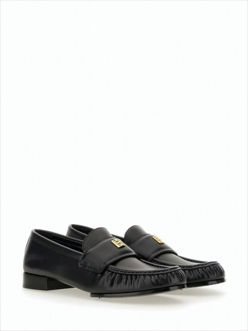 Black Lambskin Loafers with Moccasin Toe and Gold Emblem