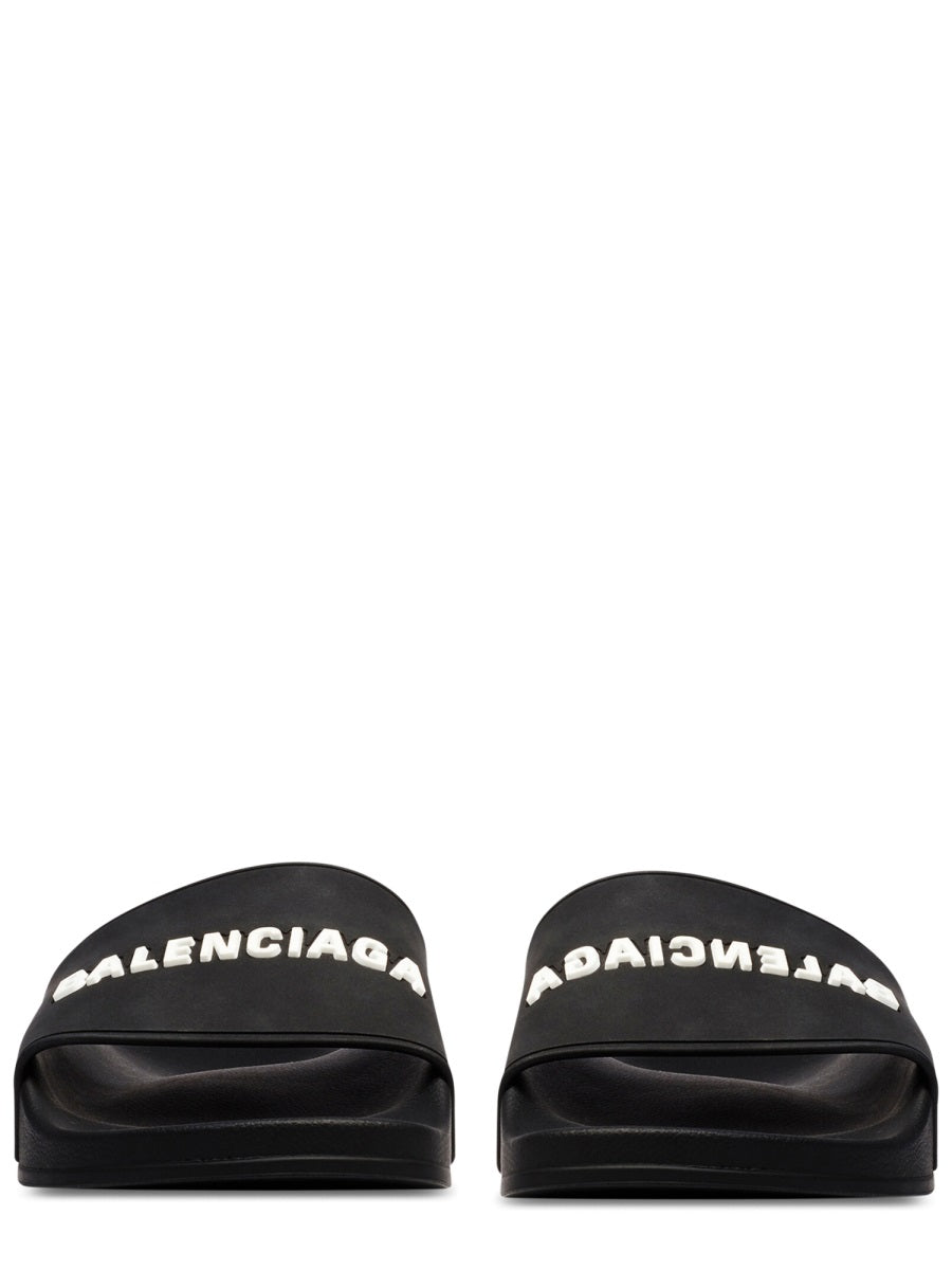 Contoured Black Slip-On Sandal With Bold Logo Print