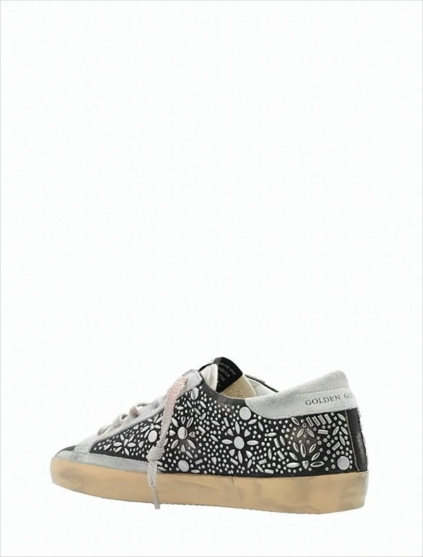 Black Leather Low-Top Sneakers with Floral Cut-Out Design