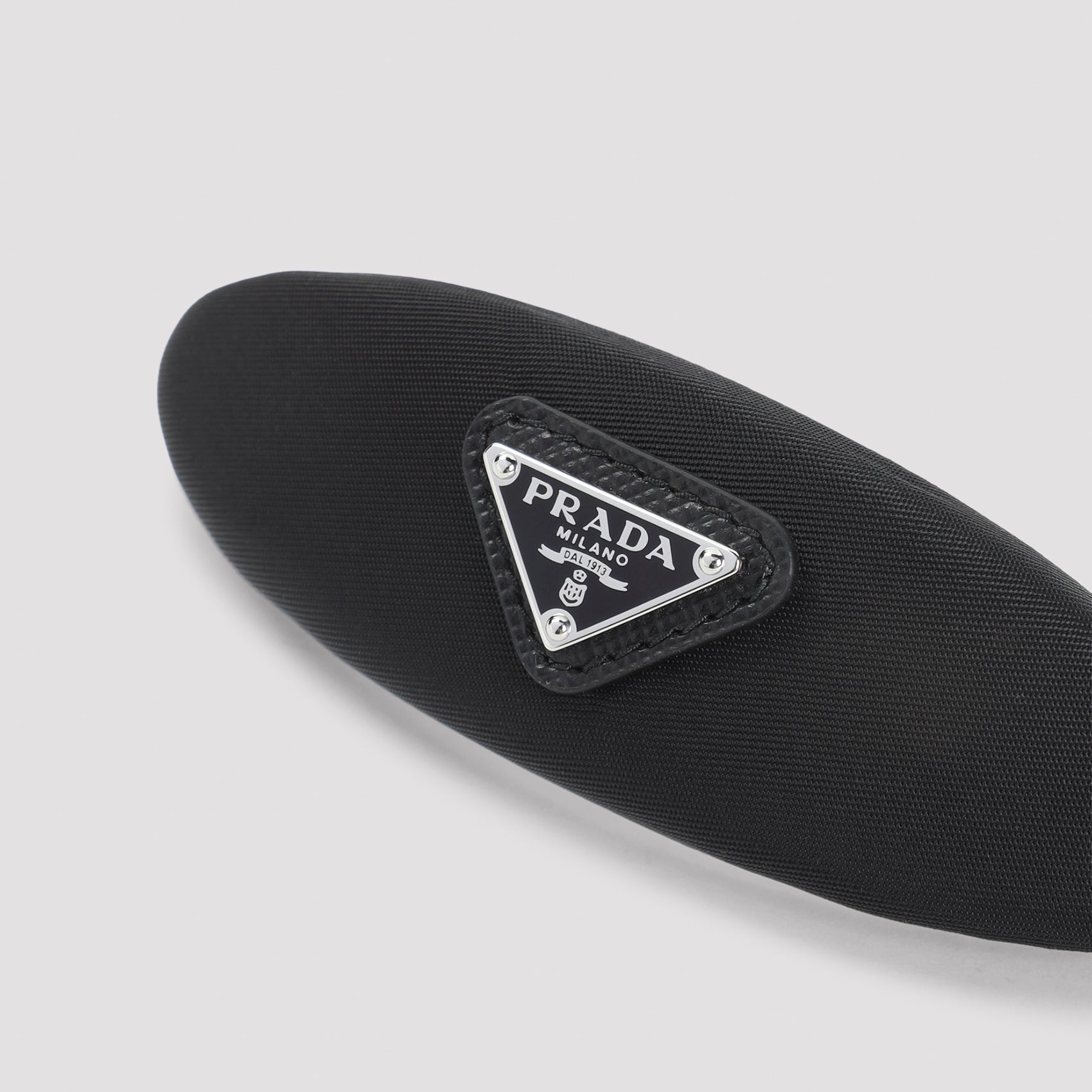 Oval Hair Barrette with Triangular Logo Plaque