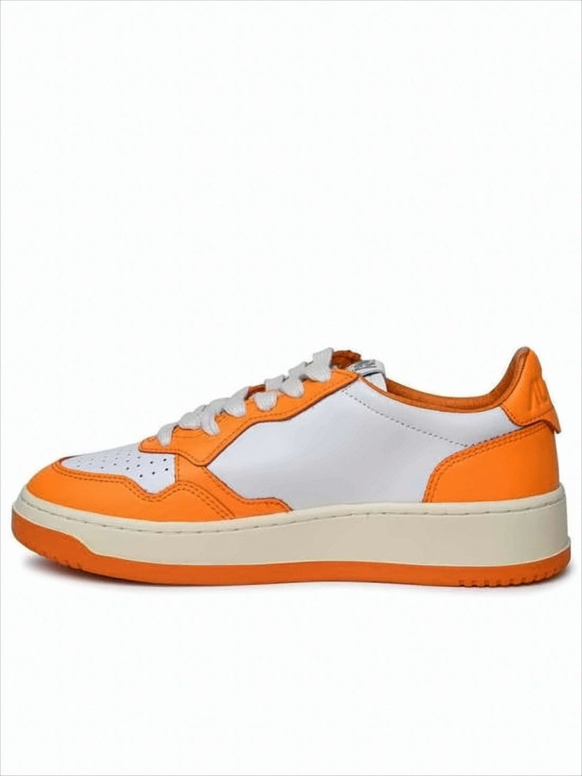 Low-Top Sneakers with Vibrant Orange Overlays and Perforated Detailing
