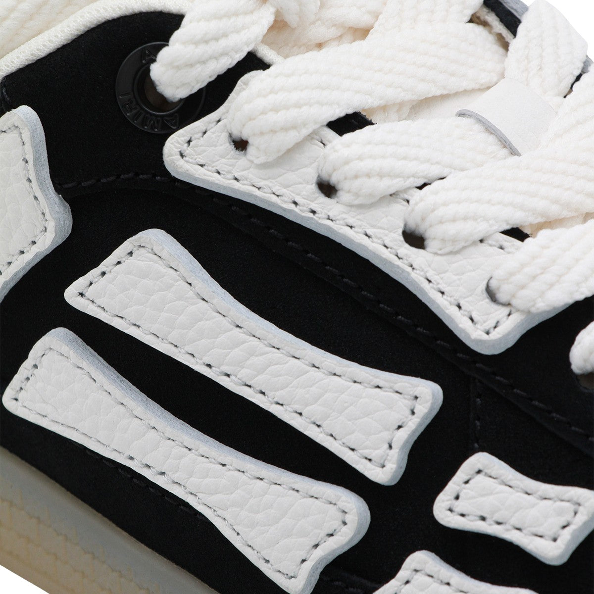 Black Sneakers with White Bone-Shaped Overlays