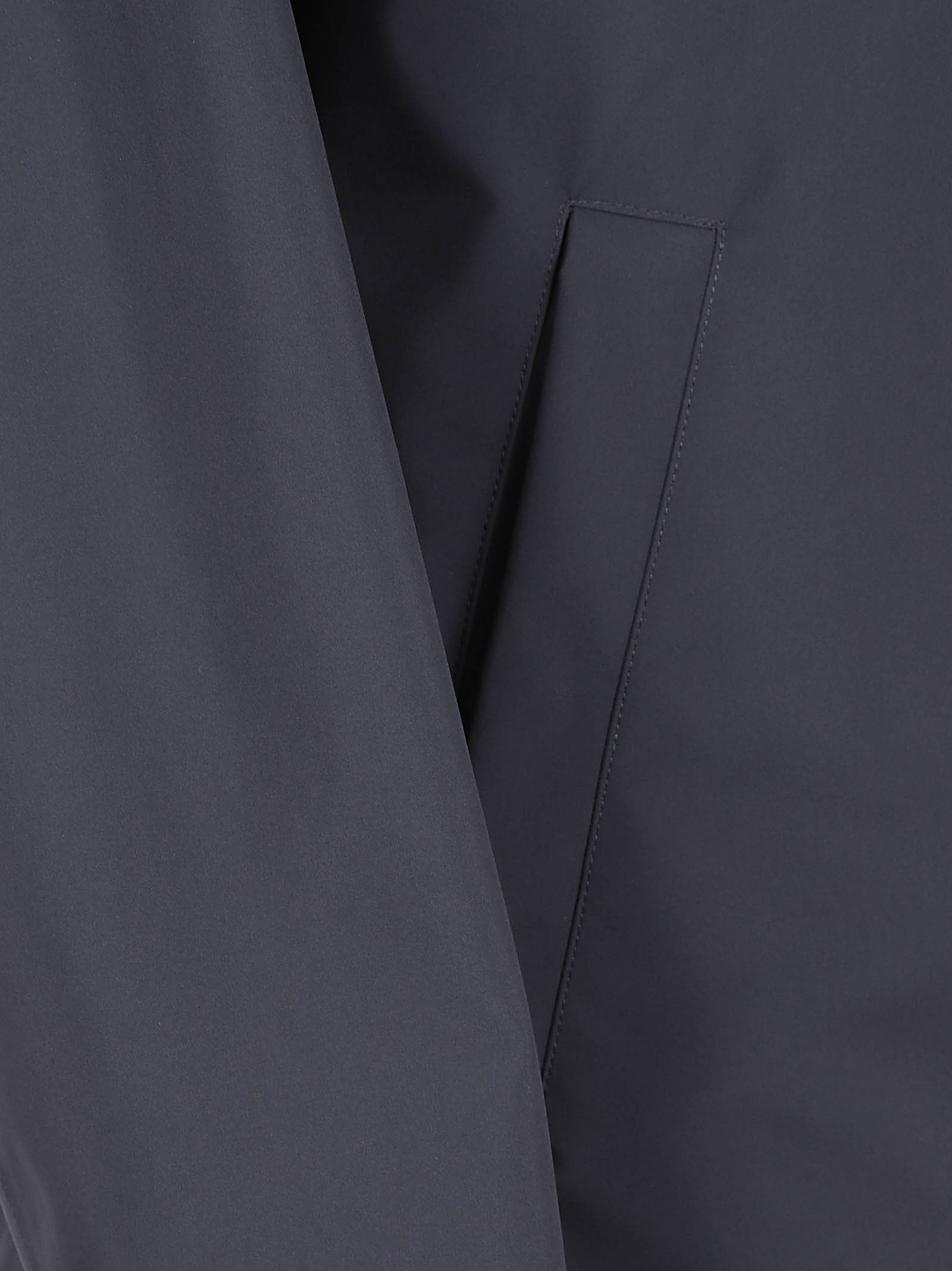 Blue Jacket with High Collar and Concealed Closure