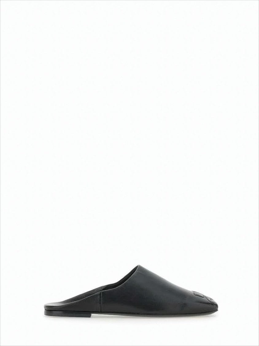 Minimalist Black Lambskin Slip-On Mules with Embossed Detail