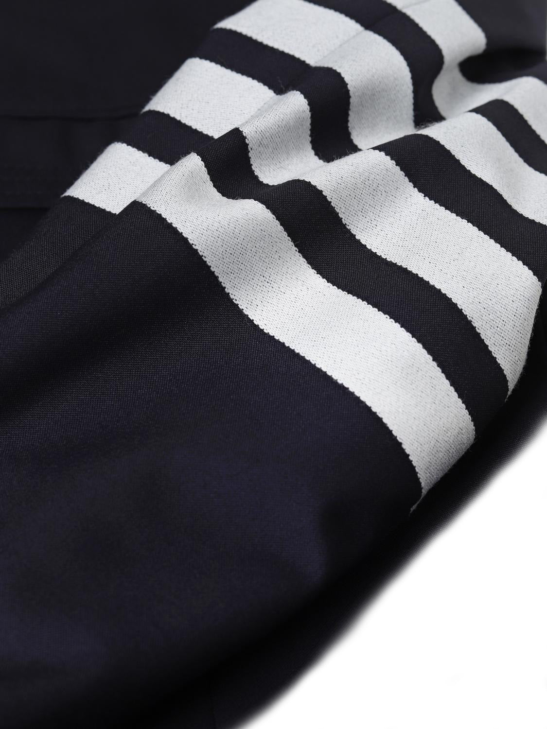 Tailored Black Coat with Asymmetrical Front and Signature Stripe