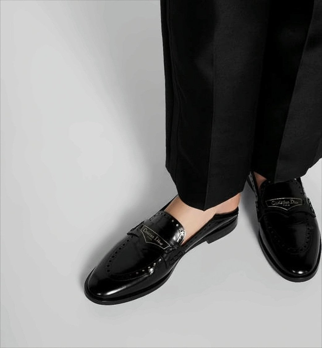 Sleek Backless Loafers with Perforated Detailing and Branded Plaque