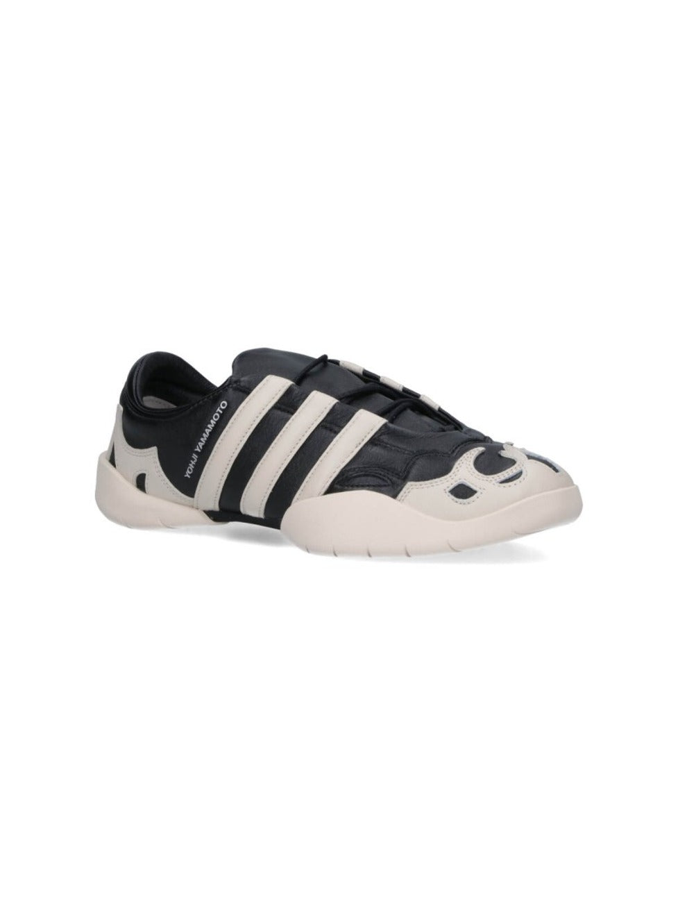 Black Leather Sneakers With Cream Accents And Iconic Stripes