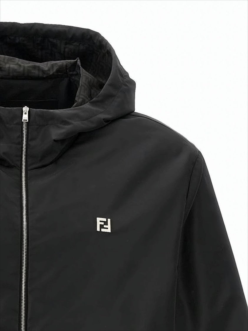 Black Hooded Jacket With Minimalist Design And Subtle Logo
