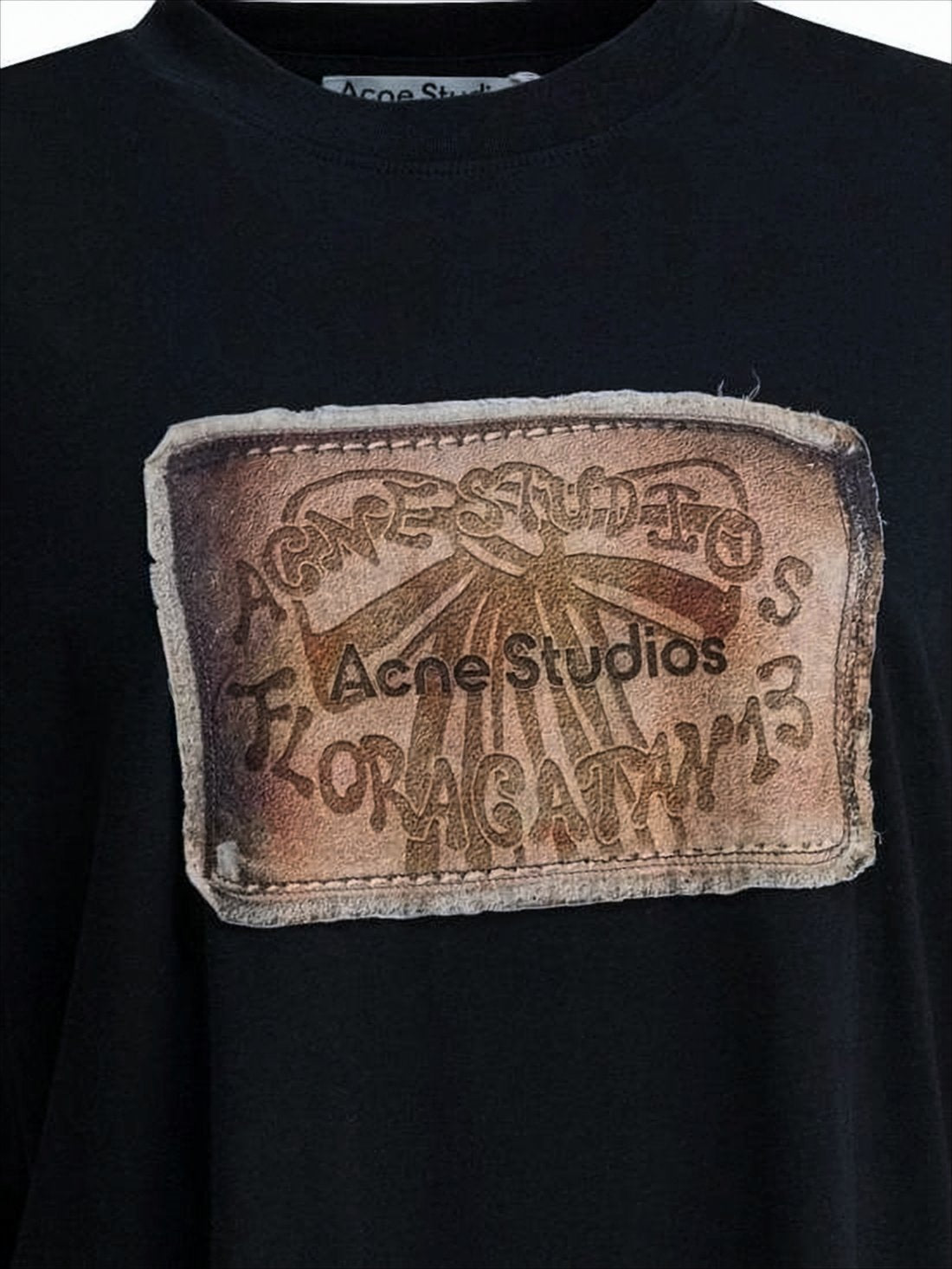 Vintage-Style Black T-Shirt with Distinctive Patch