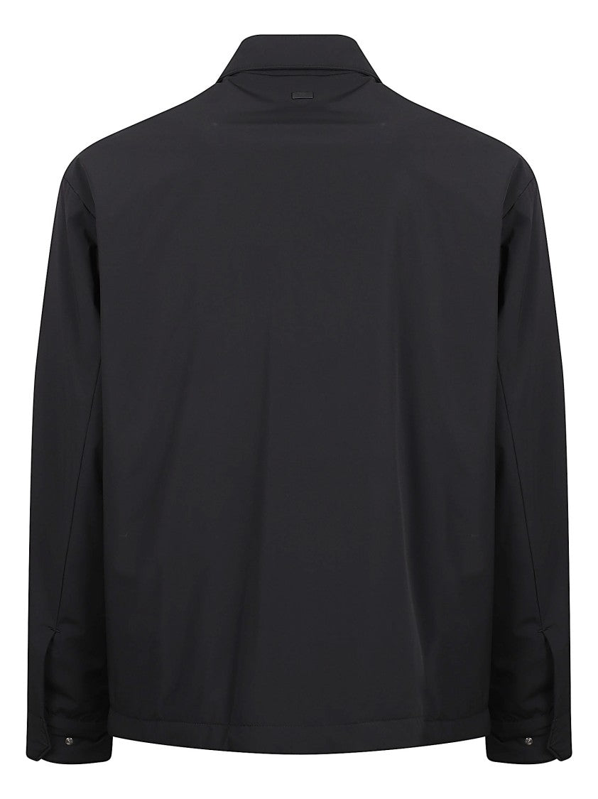 Minimalist Jacket With Concealed Closure And Adjustable Cuffs