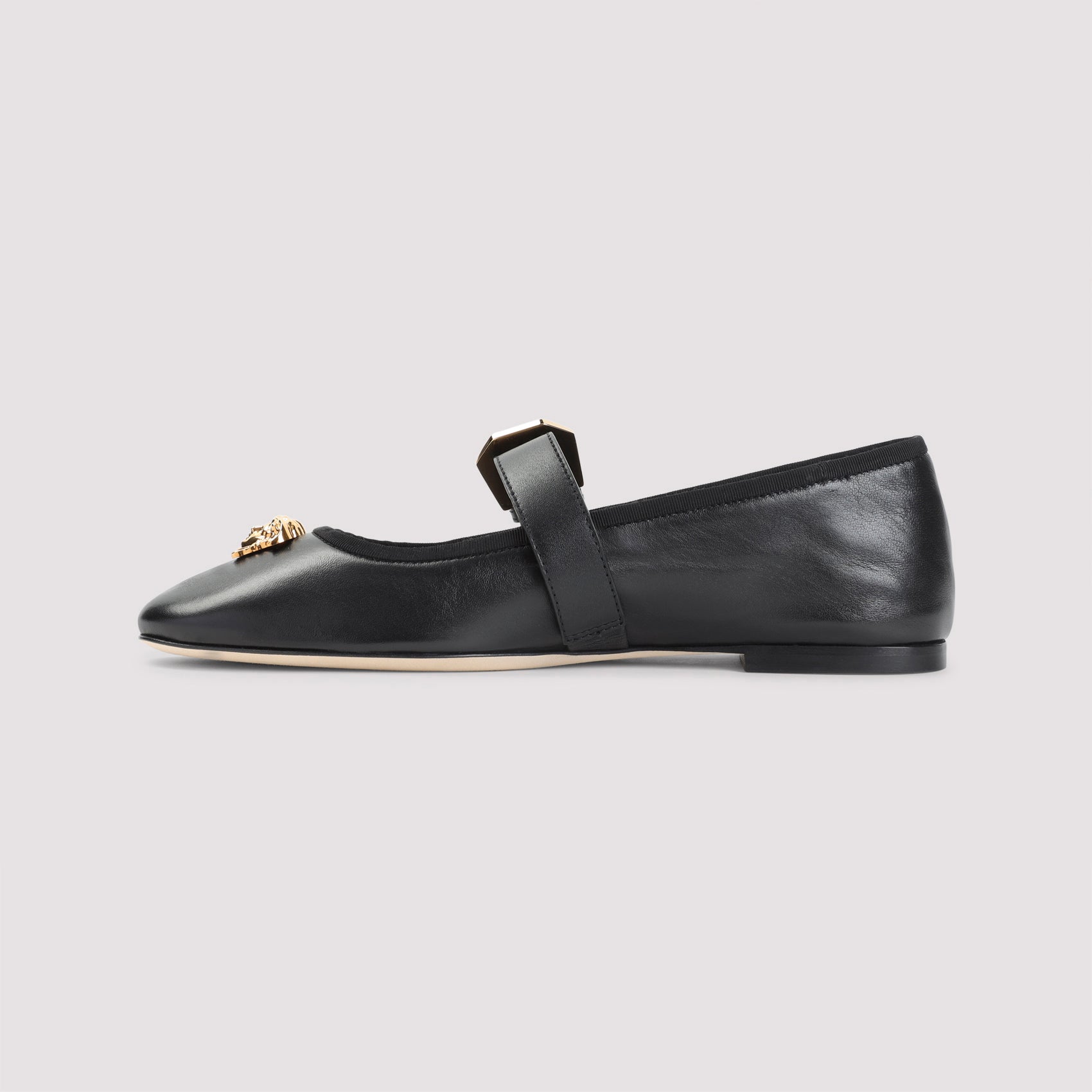 Pointed Toe Black Leather Flats with Gold Medusa Accents