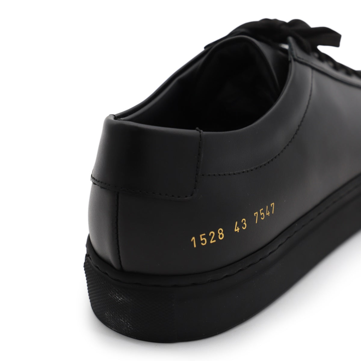 Minimalist Black Leather Sneakers With Gold Detailing