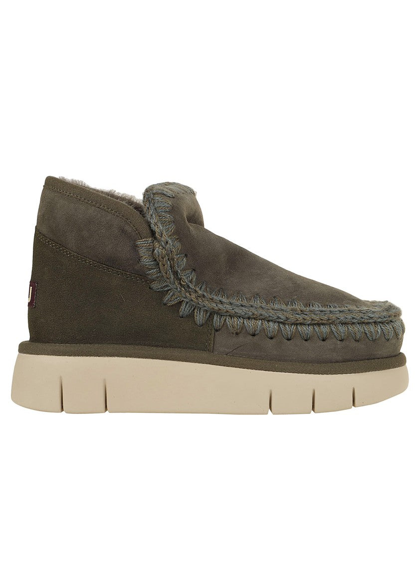Moccasin-Inspired Ankle Boots With Whipstitch Detailing