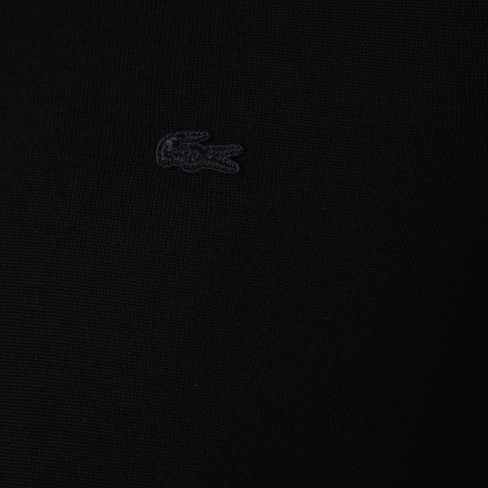 Sweter z wełny merynosowej z dekoltem w serek ze ściągaczem i haftowanym detalem