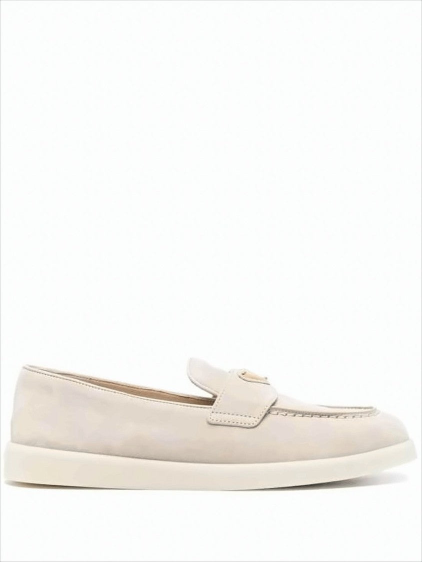 Minimalist Suede and Calf Leather Loafers with Metallic Emblem