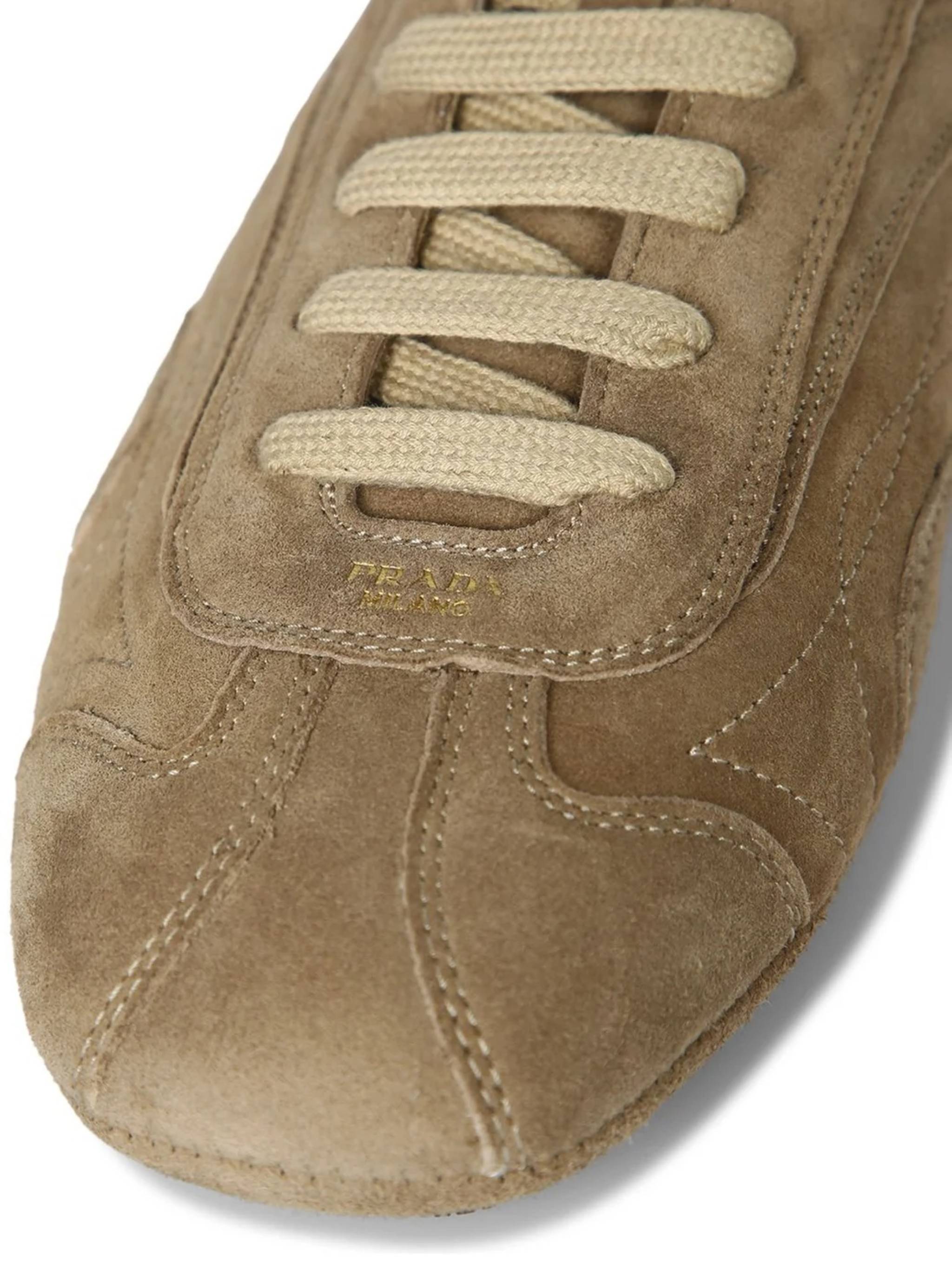 Low-Profile Brown Suede Sneakers with Intricate Stitching
