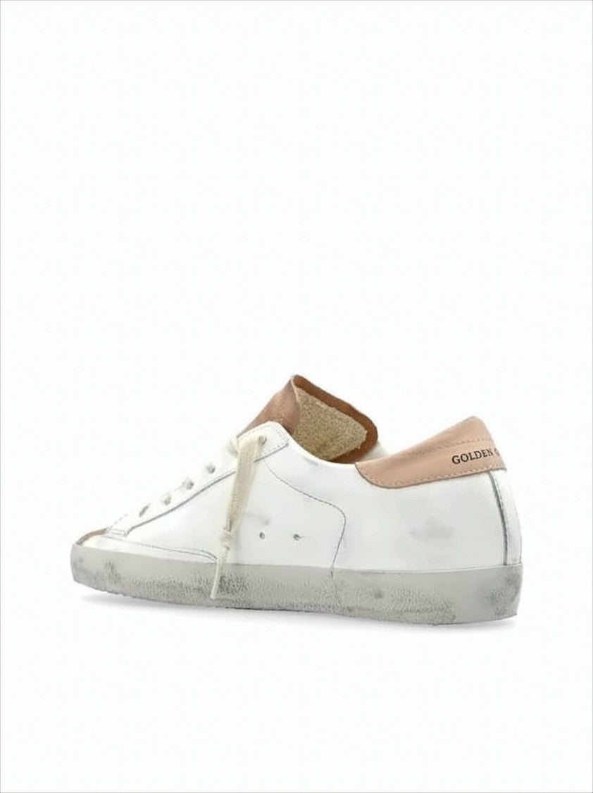 Low-Top White Leather Sneakers With Beige Suede Accents And Distressed Finish