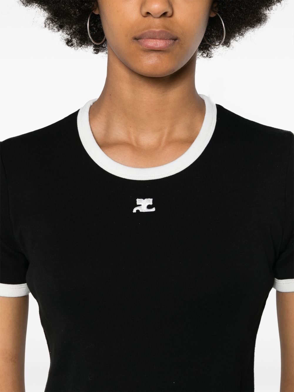 Fitted Black Top With Contrast Trim And Subtle Logo